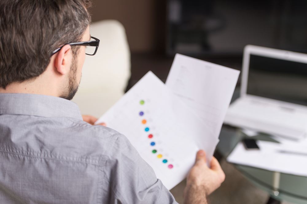 young man looking over papers